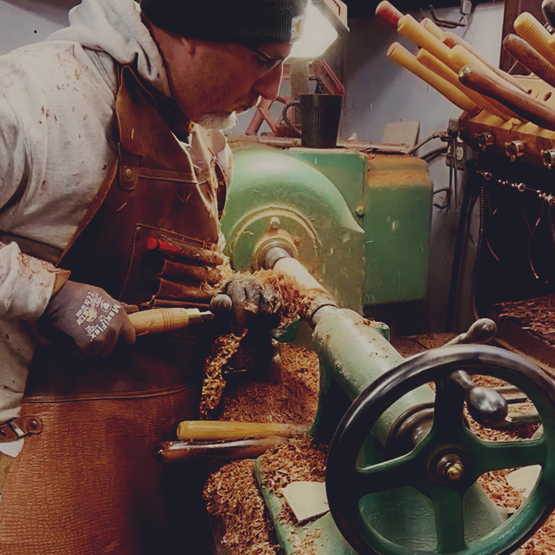 turning wood craftsman making multiple newells to order