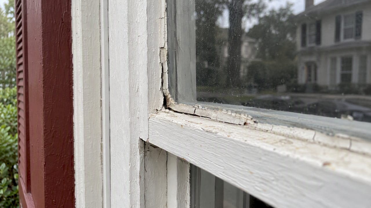 Cracked putty at a historic sash window